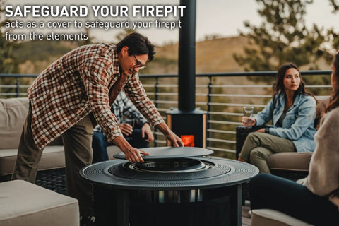 Person placing Surround Surface For Yukon Fire Pit Lid Durable Cold Rolled Steel Shield, 34.5 Inch Diameter, on a patio.