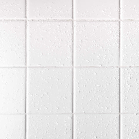 Image of water droplets on white tile, showcasing the effectiveness of Grout Sealer 16 Oz Clear For Tile And Grout Natural Finish Indoor And Outdoor Protection Fast Dry Long Lasting Easy Rinse Water Repellent Sealant For Shower Kitchen Bathroom Floors Stain Busting And Moisture Barrier.