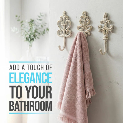 Distressed White Cast Iron Wall Hooks Set Of Three Dang Sturdy Farmhouse Coat Rack Hardware with pink towel in bathroom.