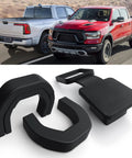 RAM 1500 Towing Hook Cover With Custom Fit For 2019 To 2025 Paired With A 2 Inch Trailer Hitch Receiver Cover That Wont Fall Off Durable Black Finish Built For Daily Washes And Rough Roads with close-up of black cover pieces and two RAM trucks