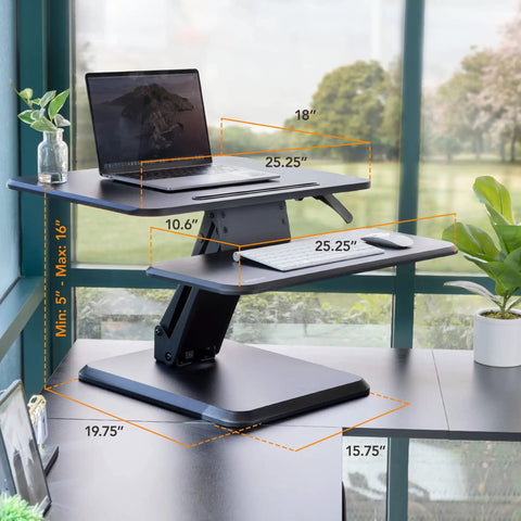 Compact 25 Inch Standing Desk Converter Sit Stand Desk Riser with gas spring lift, laptop and keyboard on adjustable height riser