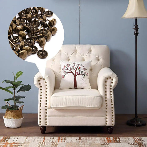 Pro Grade Bronze Upholstery Tacks And Decorative Furniture Nails For Wood Restoration rust resistant metal thumb pins on a chair.