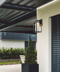 Capulet Amber Glass Center Column Outdoor Indoor Wall Sconce With LED Black Finish on modern patio wall