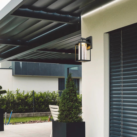 Capulet Amber Glass Center Column Outdoor Indoor Wall Sconce With LED Black Finish on modern patio wall