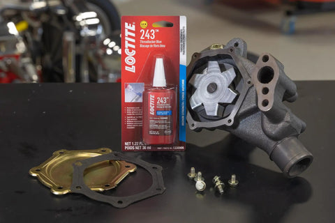 Medium Strength Surface Insensitive Threadlocker For 1/4 To 3/4 Inch Fasteners on a table with automotive parts