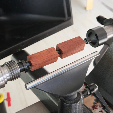 BMWOOD PM-002 MT2 pen mandrel kit mounted on lathe with red wood pen blanks