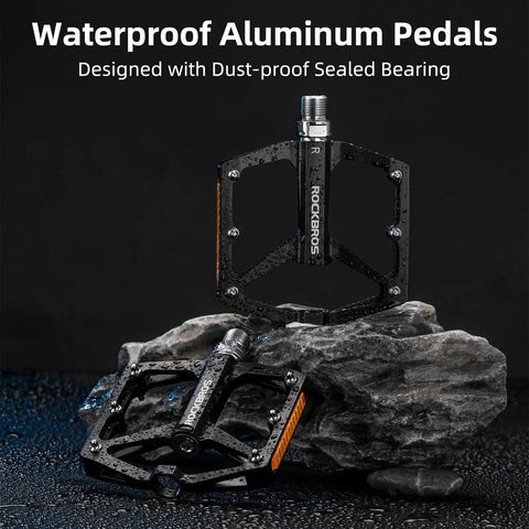 Dope Aluminum Flat Pedals With Reflective Strips For Mountain Bikes And BMX MTB Road Bikes, 9/16 Inch Sealed Bearing displayed on rocks