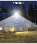 JUDYSSY 200W Led Flood Light illuminating a large area outside a building, showcasing 20000lm brightness and 120° coverage.