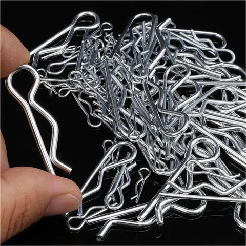Hand holding steel cotter pin from Beefy Heavy Duty R Type Cotter Pins Kit 500 Pieces Steel Hairpin Retaining Wire Fasteners For Trailer Hitch