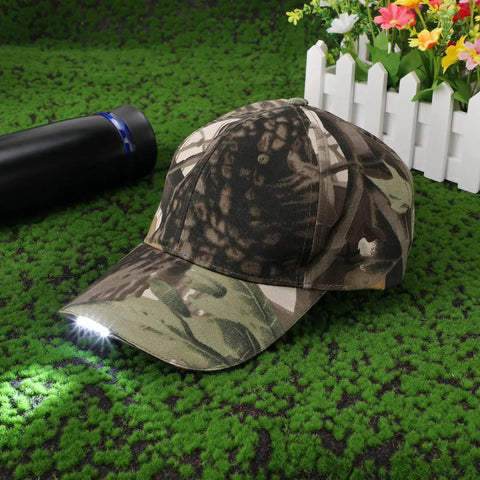 Rechargeable LED Baseball Cap With USB Cable And Battery, Five LED Lights Built In, camouflage cap on grass background