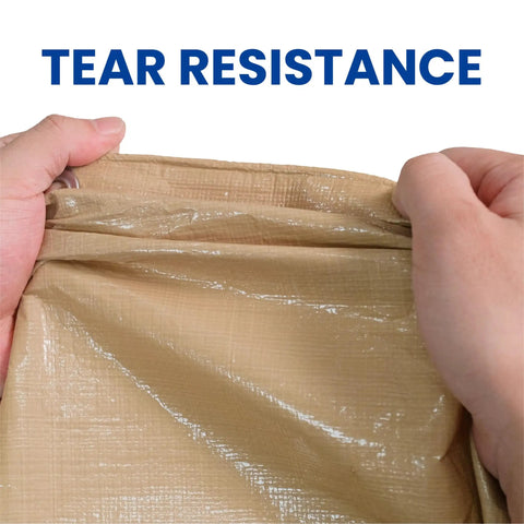 Hands displaying tear resistance of Beige 6x8 Heavy Duty Waterproof Tarp 12.5 Mil Ultra Tough Tear Resistant Poly Cover for outdoor use.