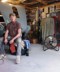 Man in garage with 20 Inch High Velocity Garage Floor Fan With Tilt Adjustable Head, 3 Speed Settings, Black SAFF-20