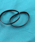 Garage Ready Replacement Drive Belts Pack Of Two For Jointer Planer Machines, durable rubber belts displayed on blue fabric.