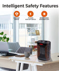 Compact Electric Space Heater That Cranks Out Warmth For Indoor Use, 1500W PTC Ceramic With Fan-Forced Heat on desk