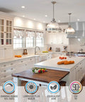 Modern kitchen with 6 Inch Gimbal LED Recessed Downlight No Brainer Dimmable 5CCT installed, featuring pendant lights and white cabinets.