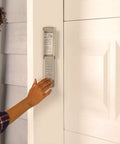 Person using wireless garage door keypad with illuminated backlit pad, no wiring required, super easy install, gray exterior keypad for home garage entry