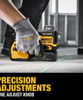 Person adjusting Line Laser Kit For 12V And 20V Max XR Green Three 360 Degree Beams High Precision With Visible Range Pro Jobsite Tool on floor