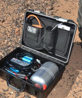 Heavy Duty Road Trip Ready 12 Volt Twin Motor Portable Air Compressor in protective case with tank and accessories.