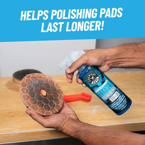 Man holding Foam And Wool Polishing Pad Cleaner Citrus Based 16 Oz Cleans And Revitalizes Pads Prevents Clogging And Extends Pad Life For Auto Detailing Removes Wax And Compound Residue Safe For All Pad Types next to polishing pad.