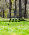 Resetting Steel Target Set For Airsoft BB Guns And Rimfire Caliber 22 And 177 in a grassy outdoor setting