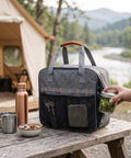 Built Tough Camping Gas Tank Bag With 320D Cationic Fabric on picnic table near a tent by a river