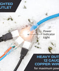 All Weather 100 Ft Outdoor Extension Cord with 3 Outlets on snowy ground, lighted plug, heavy duty 12/3 SJEOW