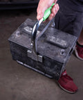 Heavy Duty Battery Carrier Lifter And Grab Tool For Top Post And Side Post Batteries With Rubber Pad Grip in use lifting a battery
