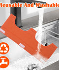 Reusable and washable hard hat liner in sink showcasing water resistance, bright orange color, and flame retardant properties.