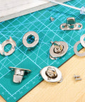 Built Tough Galvanized Turn Button Fasteners Twenty Pack Twist Lock Hardware detail on cutting mat for outdoor projects.
