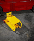 HEAVY DUTY YELLOW POWDER COATED STEEL WELDING CART WITH SMOOTH ROLLING CASTERS AND SLANTED WORK SURFACE BUILT TO CRUSH THE GRIND AND HAUL YOUR GEAR FAST on a garage floor next to a classic car.