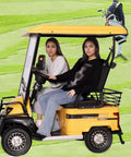 Kick Back And Roll With This Hella Durable Electric Golf Cart Featuring A Robust 800 Watt Motor, two women seated inside, golf course background.