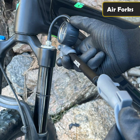 ShockPro MTB Shock Pump With 300 PSI High Pressure Gauge in use on mountain bike fork