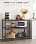 Industrial Kitchen Island Featuring Three Tier Storage And Generous Worktop, Rock Solid Steel Frame Built For Real Life Messes, Rustic Brown And Black Finish, Zero Sweat Quick Setup For Any Space with coffee maker and microwave.