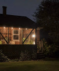 Backyard Bistro Style 24 Foot Outdoor String Lights With 12 Shatter Resistant Lifetime Bulbs illuminating a porch at night