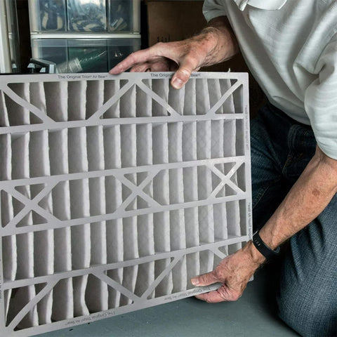 Person holding Air Bear 20 x 25 x 5 Inch MERV 8 High Performance Air Purifier Filter Replacement, showing front panel detail