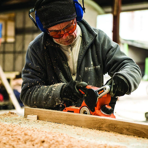 Person using Beast 750W 2 in 1 Electric Wood Planer And Sander With 17 Position Depth Control in a workshop setting
