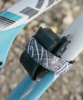 Rockband Frame Carrying Strap For Inner Tubes And Bike Tools, Easy Frame Mounted Storage For Mountain Biking Essentials, No Backpack Needed, Keep Spare Tubes And Tools Within Reach On Every Ride, strapped to a bike frame