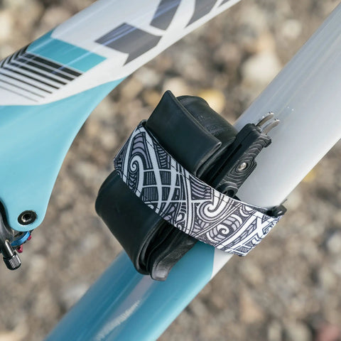 Rockband Frame Carrying Strap For Inner Tubes And Bike Tools, Easy Frame Mounted Storage For Mountain Biking Essentials, No Backpack Needed, Keep Spare Tubes And Tools Within Reach On Every Ride, strapped to a bike frame