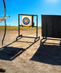Heavy Duty Archery Target Stand Cover For Bow And Arrow Thick Protective Shield For Indoor Outdoor Practice Weatherproof Nylon Protector Fits 47.2 Inch High By 35.4 Inch Wide Stands Easy Setup shown in use outdoors.