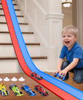 Child playing with Flexible Fifteen Foot Race Car Track Set For Kids With Double Sided Racetrack Suction Cups Portable Roll Up Track