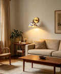MECOLA Vintage Ceramic Shade Wall Sconce Adjustable Angle Wall Mount Light illuminating a living room with beige sofa.