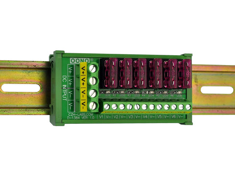 Six Channel DC Power Fuse Distribution Strip Module with DIN Rail Mount shown installed, handles 0-32V, up to 30A total, each channel up to 3A.