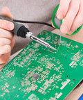 Person using 0.8mm Lead Free Solder Wire With Rosin Core 200g Spool For Electronics DIY Projects Sn Ag Cu Alloy on PCB