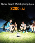Group camping scene lit by 3200LM Camping Lantern With 4600mAh Phone Charger, two tents in the background.