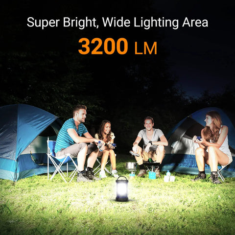 Group camping scene lit by 3200LM Camping Lantern With 4600mAh Phone Charger, two tents in the background.