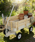 Steel Frame Wagon With 8 Inch All Terrain Air Tires And Wooden Side Panels carrying gardening tools in a sunny garden