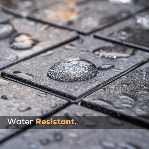 Pro Grade Wet Look Concrete And Paver Sealer 5 Gallon Water Based Acrylic Coating on textured paver with water droplets.