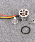 RC Brushless Motor 1700KV for Fixed Wing Planes Lightweight Replacement Part shown with components on grey surface