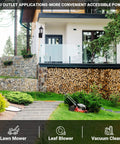 Dusk To Dawn Sensor Outdoor Wall Lantern with Built In GFCI Outlet on modern home exterior near lawn mower and garden.