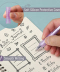 Hand using Pastel Purple Gel Pen Set 12 Pack With One Matching Highlighter Black Ink 0.5mm Fine Point Smooth Gel Pens For Journaling School And Office Aesthetic Girly Stationery on notebook, showing soft silicon cover and smooth writing.